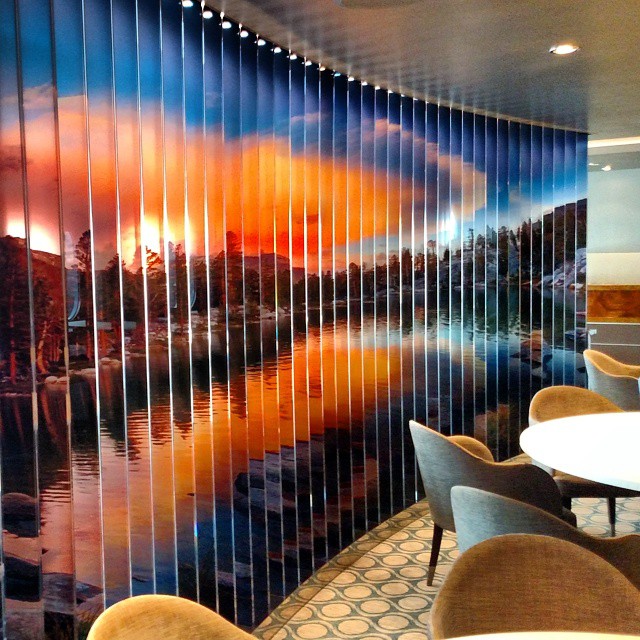 Glass panels divide the room & show beautiful landscapes at American Icon Grill